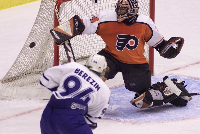  John Vanbiesbrouck makes a save against the Maple Leafs during his team with the Philadelphia Flyers.