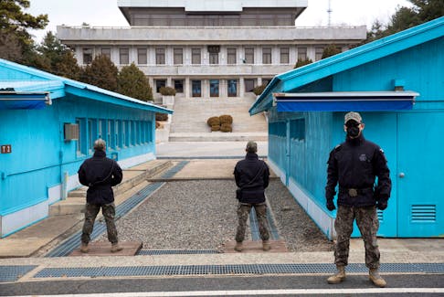 South Korean soldiers stand guard during a media tour at the Joint Security Area (JSA) on the Demilitarized Zone (DMZ) in the border village of Panmunjom in Paju, South Korea, 03 March 2023. JEON HEON-KYUN/Pool via