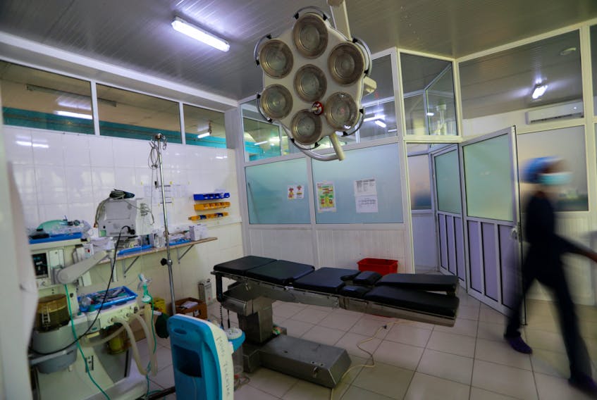 A nurse walks into the operating theatre, where children were treated for Acute Kidney Injury, at the Edward Francis Small Teaching Hospital in Banjul, Gambia, November 4, 2022. In October 2022, the deaths of more than 70 Gambian children from Acute Kidney Injury were linked by global health officials to cough syrups made in India and contaminated with ethylene glycol (EG) and diethylene glycol (DEG)/