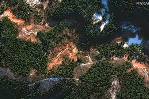 A satellite image shows multiple landslides as they Block Route 40, in Machinomachi, Japan, January 2, 2024. Maxar Technologies/Handout via