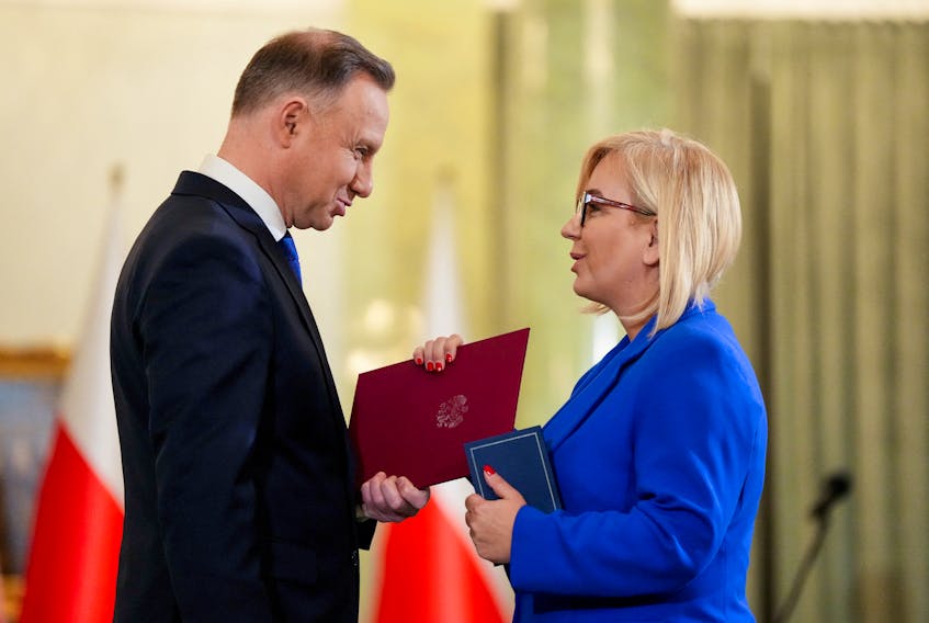Polish President Andrzej Duda and newly appointed Polish Environment Minister Paulina Hennig-Kloska attend the cabinet swearing-in ceremony at the Presidential Palace in Warsaw, Poland December 13, 2023.