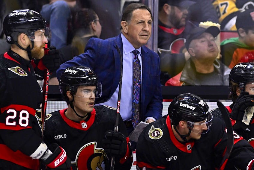 Ottawa Senators interim head coach Jacques Martin stands behind the bench.