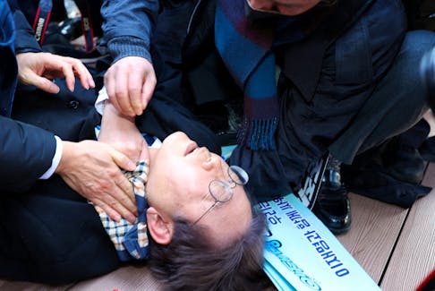 South Korea's opposition party leader Lee Jae-myung falls after being attacked by an unidentified man during his visit to Busan, South Korea, January 2, 2024/ File Photo