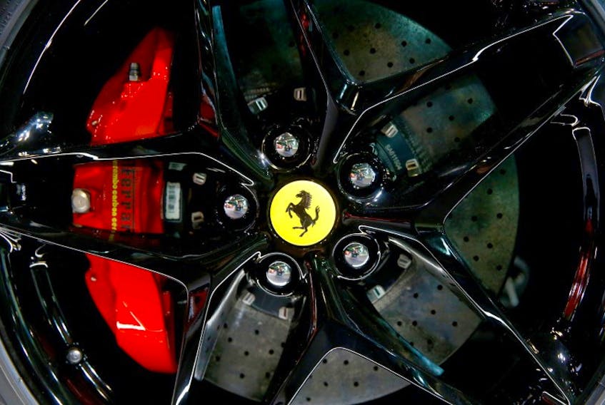The company's logo is seen on a wheel hub of a Ferrari SF90 Stradale hybrid sports car during a media preview at the Auto Zurich Car Show in Zurich, Switzerland November 3, 2021.