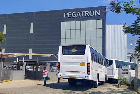 Employee buses enter the Pegatron facility near Chennai, India, March 7, 2023.
