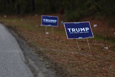 Signs supporting Former U.S. President Donald Trump stand ahead of the South Carolina Republican presidential primary election in Bonneau, South Carolina, U.S., January 31, 2024.