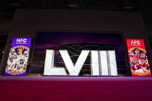 Feb 9, 2024; Las Vegas, NV, USA; The Super Bowl 58 roman numerals at the NFL Experience with images of  San Francisco 49ers running back Christian McCaffrey (23), quarterback Brock Purdy (13), tight end George Kittle (85), defensive end Nick Bosa (97) and linebacker Fred Warner (54) and Kansas City Chiefs center Creed Humphrey (52), quarterback Patrick Mahomes (15), tight end Travis Kelce (87), wide receiver Rashee Rice (4) and defensive tackle Chris Jones (95) at the Mandalay Bay South Convention Center. Mandatory Credit: Kirby Lee-USA TODAY Sports