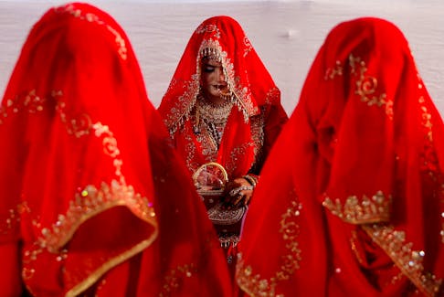 Muslim women are seen during a mass marriage ceremony, in which, 51 Muslim couples took their wedding vows, in Mumbai, India, January 14, 2024.