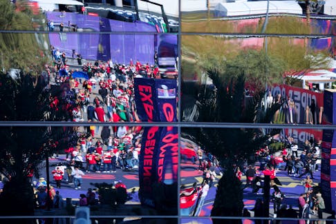 Football - NFL - Super Bowl LVIII - Kansas City Chiefs v San Francisco 49ers - Allegiant Stadium, Las Vegas, Nevada, United States - February 11, 2024 General view of fans outside the stadium is seen in a reflection before the game