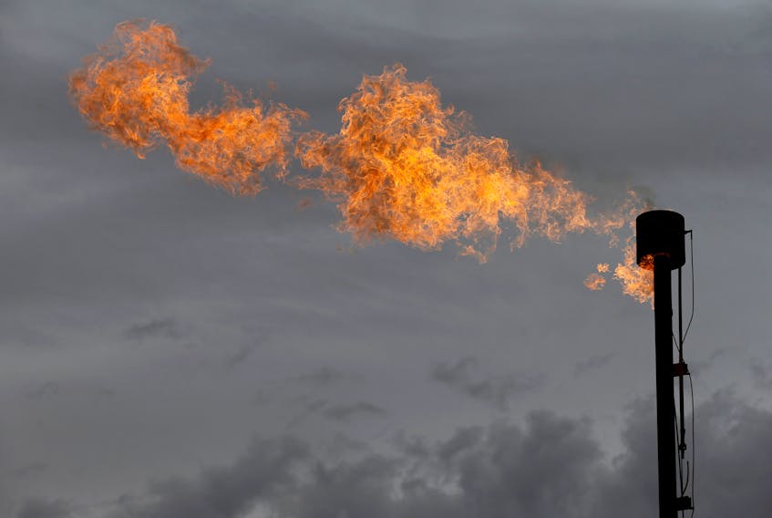 A flare burns off excess gas from a gas plant in the Permian Basin in Loving County, Texas, U.S., November 25, 2019.REUTERS/Angus Mordant/File Photo