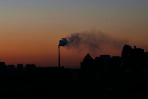 Smoke rises from a chimney of a cogeneration plant in Beijing November 25, 2013. 
