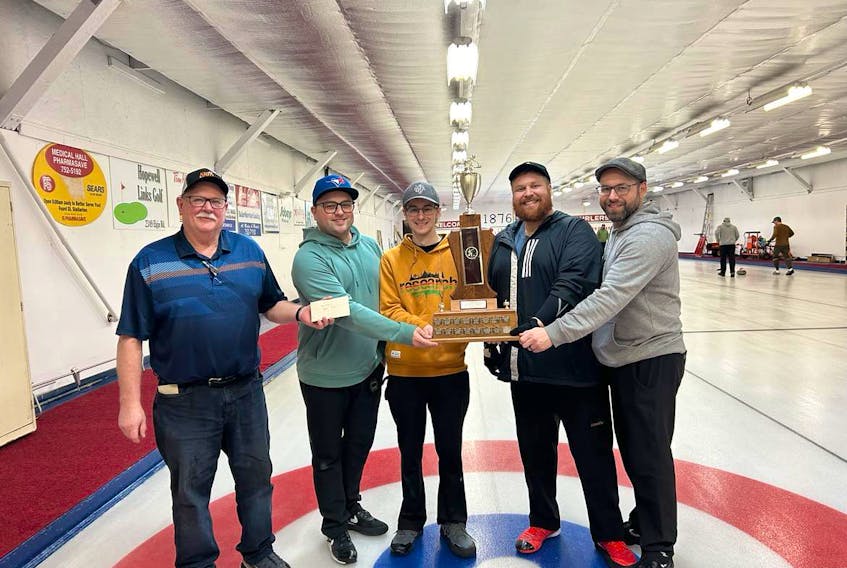 Team Travis Stone captured the Ship Hector Trophy on mainland Nova Scotia on Sunday. Second from the left, Travis Stone, Sebastien LeFort, Todd Mercer and Robin Nathanson. CONTRIBUTED/SYDNEY CURLING CLUB