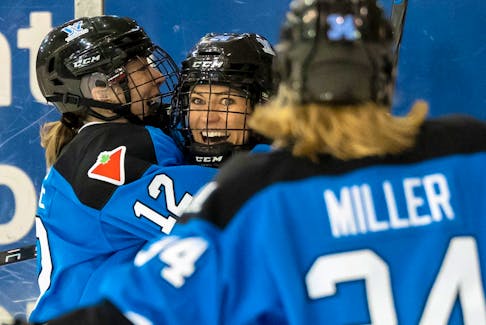 Toronto's Natalie Spooner (24) celebrates with teammates Allie Munroe (12) and Hannah Miller (34) after scoring against New York in Toronto on Friday January 26, 2024. 