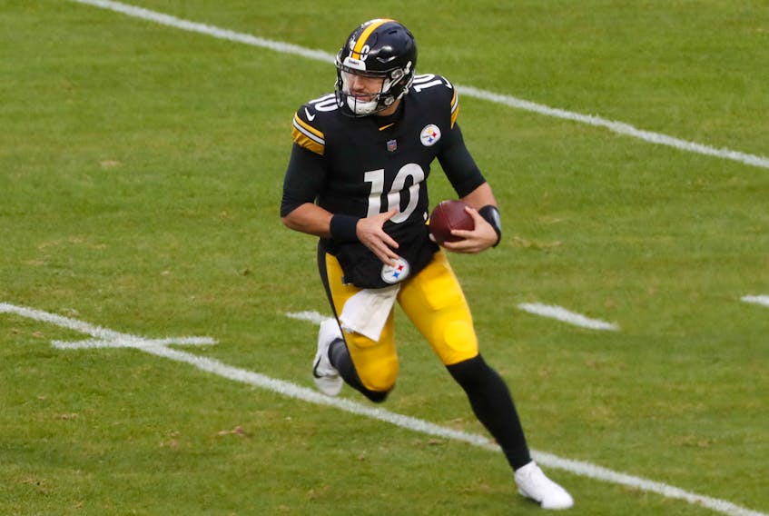 Dec 11, 2022; Pittsburgh, Pennsylvania, USA;  Pittsburgh Steelers quarterback Mitch Trubisky (10) scrambles with the ball against the Baltimore Ravens during the third quarter at Acrisure Stadium. Baltimore won 16-14. Mandatory Credit: Charles LeClaire-USA TODAY Sports/File Photo