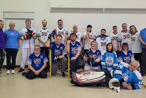 Team Nova Scotia's floor hockey squad that will be competing at the Special Olympics Canada Winter Games from Feb. 27 to March 2 in Calgary pose for a team photo. Front row, from left, are Dale Stewart, Sandy Morrison, Jeremy Fahie, Eden Bell, Kelly Goreham, Cheyenne Arbour and goalie Dale Roache. Second row, head coach Donovan Reiter, assistant coach Kim Arcon, Andrew Hicks, Chris Carlson, Ashley Rennehan, Martin Fudge, Nikolai Reider, Stephen Goreham, Rory Arcon, David Wile, Wilma Wile and assistant coach David Fahie. Contributed