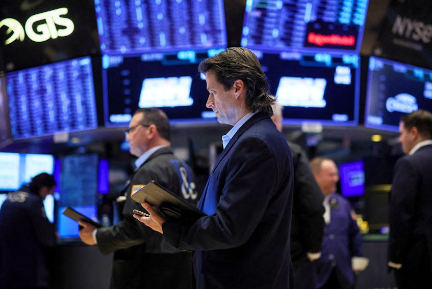 Traders work on the floor at the New York Stock Exchange (NYSE) in New York City, U.S., February 6, 2024. 