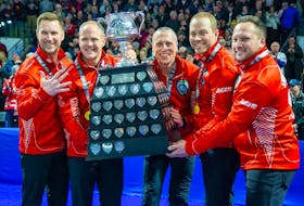 Team Canada L to R Brad Gushue (flashing a five fingers signifying his fifth championship), Mark Nichols, E.J. Harnden, Geoff Walker coach Caleb Flaxey hoist The Brier Tankard after 7-5 victory in The Brier championship game against Matt Dunstone's Manitoba team at Budweiser Gardens in London, Ont. on Sunday March 12, 2023.