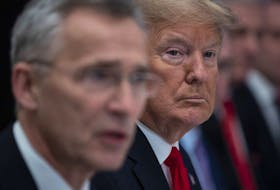 President Donald Trump listens as NATO Secretary General Jens Stoltenberg speaks with NATO members that have met their financial commitments to the the organization on Dec. 2019 in Watford, England. 