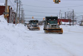 A pair of snowplows clear snow from George Street in Sydney on Wednesday. Equipment has been out on Cape Breton roads constantly for nearly two weeks as the worst of winter conditions continue to pass through. LUKE DYMENT/CAPE BRETON POST