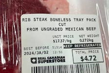 Closeup of label on package of beef that reads "rib steak boneless tray pack cut from ungraded Mexican beef." 