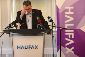 Halifax mayor Michael Savage dabs his eyes with a tissue as he gives word that he will not be re-offering as mayor of HRM, at city hall Tuesday February 13, 2024. 

TIM KROCHAK PHOTO