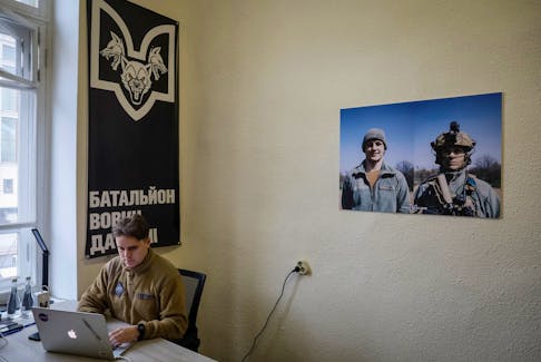 A recruitment officer waits for volunteers who aspire to join the battalion 'Da Vinci's wolves' of the Ukrainian Armed Forces, named of nom-de-guerre of their commander Dmytro Kotsiubailo, Hero of Ukraine, who was killed in a fight against Russian troops, amid Russia's attack on Ukraine, in a newly opened recruiting center in Kyiv, Ukraine February 10, 2024.