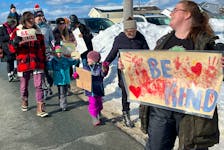 Dawn Langille, organizer a rally for kindness, leads the parade in Terence Bay on Monday, February 19, 2024.