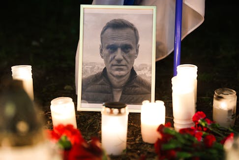 A photo of Alexei Navalny and candles are seen in front of the Russian consulate in Krakow, Poland on Feb. 16. - Jakub Porzycki/NurPhoto/Reuters