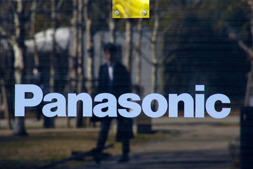 A man is reflected on Panasonic Corp's logo at Panasonic Center in Tokyo, Japan, February 2, 2017. 