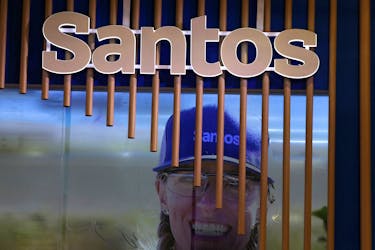 The logo of Australian oil and gas exploration and production company Santos is displayed during the LNG 2023 energy trade show in Vancouver, British Columbia, Canada, July 12, 2023.