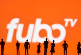 Toy figures of people are seen in front of the displayed Fubo TV logo, in this illustration taken January 20, 2022.