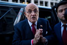 Former New York Mayor Rudy Giuliani departs the U.S. District Courthouse after he was ordered to pay $148 million in his defamation case in Washington, U.S., December 15, 2023.