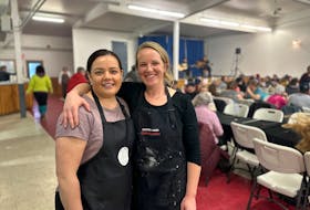 Stephanie Mitsuk and Sarah Underhay, who are part of a newly formed group in Souris called Tipsy Farmers and Friends, organize a community meal on Feb. 18 at the Eastern Kings Sportsplex. Thinh Nguyen • The Guardian