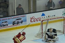 Charlottetown Islanders goaltender Carter Bickle, 1, makes a save off a shot by Acadie-Bathurst Titan forward Dawson Sharkey, 81, of Souris, P.E.I., in the third period of a Quebec Maritimes Junior Hockey League (QMJHL) at Eastlink Centre on Feb. 19. Bickle made 40 saves in the Islanders’ 3-2 victory before 3,275 fans on Islander Day. Jason Simmonds • The Guardian