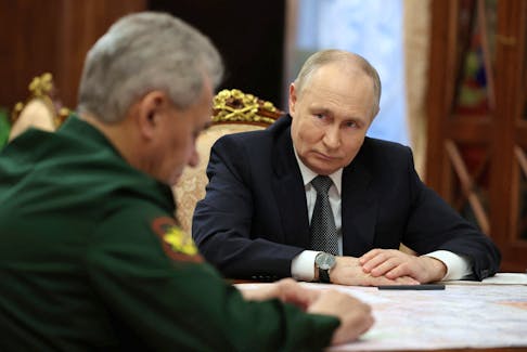 Russia's President Vladimir Putin listens to Defence Minister Sergei Shoigu during a meeting in Moscow, Russia February 20, 2024. Sputnik/Alexander Kazakov/Pool via REUTERS