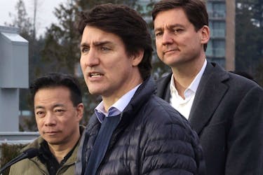 Prime Minister Justin Trudeau makes a housing announcement with the Premier of British Columbia, David Eby, and Vancouver Mayor Ken Sim at the University of British Columbia in Vancouver on Feb. 20, 2024.