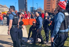 Police officers detain a person outside of Union Station following a shooting near an outdoor celebration of the NFL champion Chiefs' Super Bowl victory, in Kansas City, Missouri, U.S. February 14, 2024 in this screen grab obtained from social media video. Alyssa Contreras/via