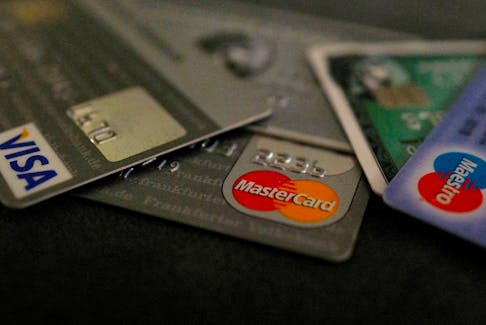 Bank debit and credit cards are photographed in this illustration picture at an office in Frankfurt, Germany, March 17, 2016.