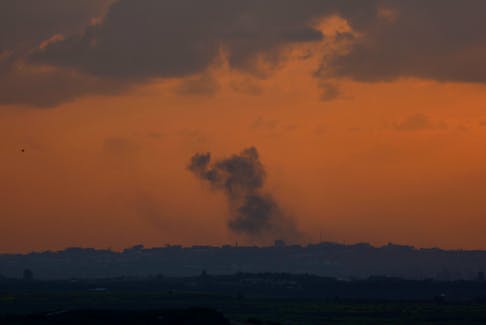 Smoke rises over Gaza, amid the ongoing conflict between Israel and the Palestinian Islamist group Hamas, as seen from Israel, February 19, 2024.