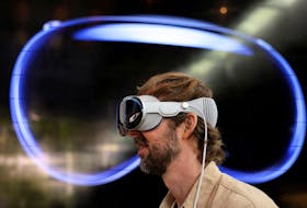 A customer uses Apple's Vision Pro headset on the day it goes on sale for the first time in Los Angeles, California, U.S., February 2, 2024.