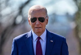 U.S. President Joe Biden walks up to members of the news media to give a statement before boarding Marine One for travel to California from the South Lawn of the White House in Washington, U.S., February 20, 2024.