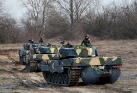 Leopard 2A4 tanks take part in a military training near Tata, Hungary, February 6, 2023.