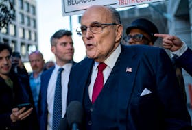 Former New York Mayor Rudy Giuliani departs the U.S. District Courthouse after he was ordered to pay $148 million in his defamation case in Washington, U.S., December 15, 2023.