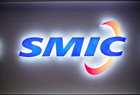 A logo of Semiconductor Manufacturing International Corporation (SMIC) is seen at China International Semiconductor Expo October 14, 2020.