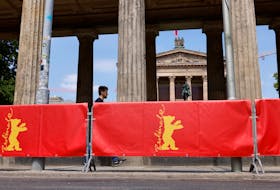 A man walks near the main Berlinale film festival venue at the old national gallery on the Museums Island in Berlin, Germany, June 8, 2021.