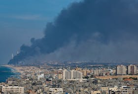 Smoke rises from the Israeli side after Palestinian Hamas gunmen infiltrated areas of southern Israel, as seen from Gaza, October 7, 2023.