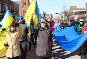 Dozens of people march in the cold in downtown Charlottetown to support Ukraine on Feb. 25, 2023 on the anniversary of Russia's invasion of Baltic country. Logan MacLean • The Guardian