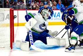 Feb 20, 2024; Denver, Colorado, USA; Vancouver Canucks goaltender Thatcher Demko (35) makes a save on Colorado Avalanche left wing Jonathan Drouin (27) in the second period at Ball Arena. Mandatory Credit: Ron Chenoy-USA TODAY Sports