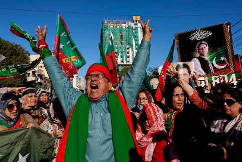 Supporters of former Prime Minister Imran Khan's party, the Pakistan Tehreek-e-Insaf (PTI), chant slogans as they gather during a protest demanding free and fair results of the elections, outside the provincial election commission office in Karachi, Pakistan February 17, 2024.