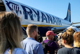 Passengers board a Ryanair flight at the airport in Gdansk, Poland, June 19, 2019.